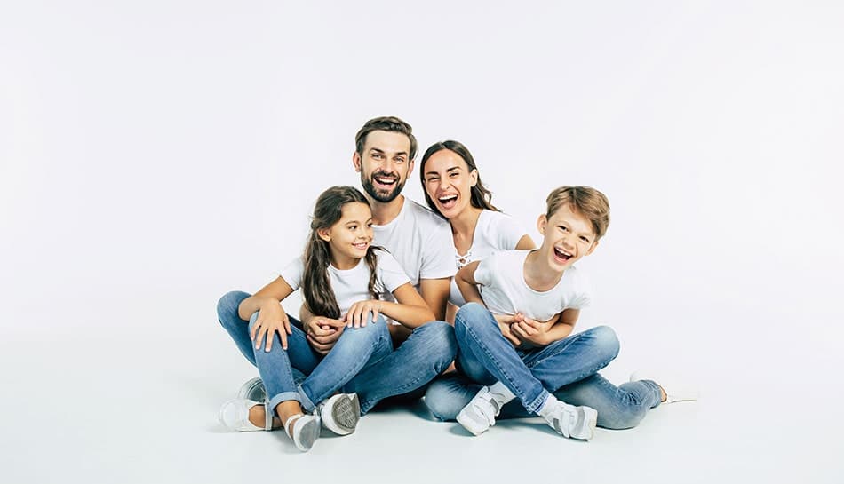 Energetic young family share a laugh together