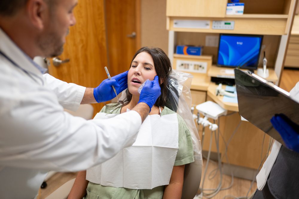 Our Naples, FL dentist evaluates a patient’s smile and facial balance during a cosmetic dentistry exam