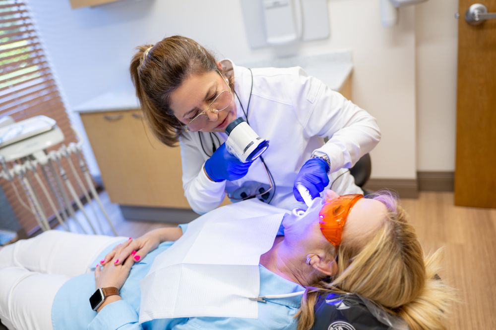 Our Naples, FL dentist uses advanced dental technology to examine a patient’s teeth and gums